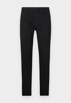 Sorte slim-fit jeans med fem lommer, knaplukning og bæltestropper, præsenteret på en ensfarvet hvid baggrund.