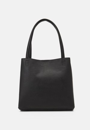 Black leather tote bag with two long handles, smooth texture, and a minimalist, rectangular shape on a plain light background.