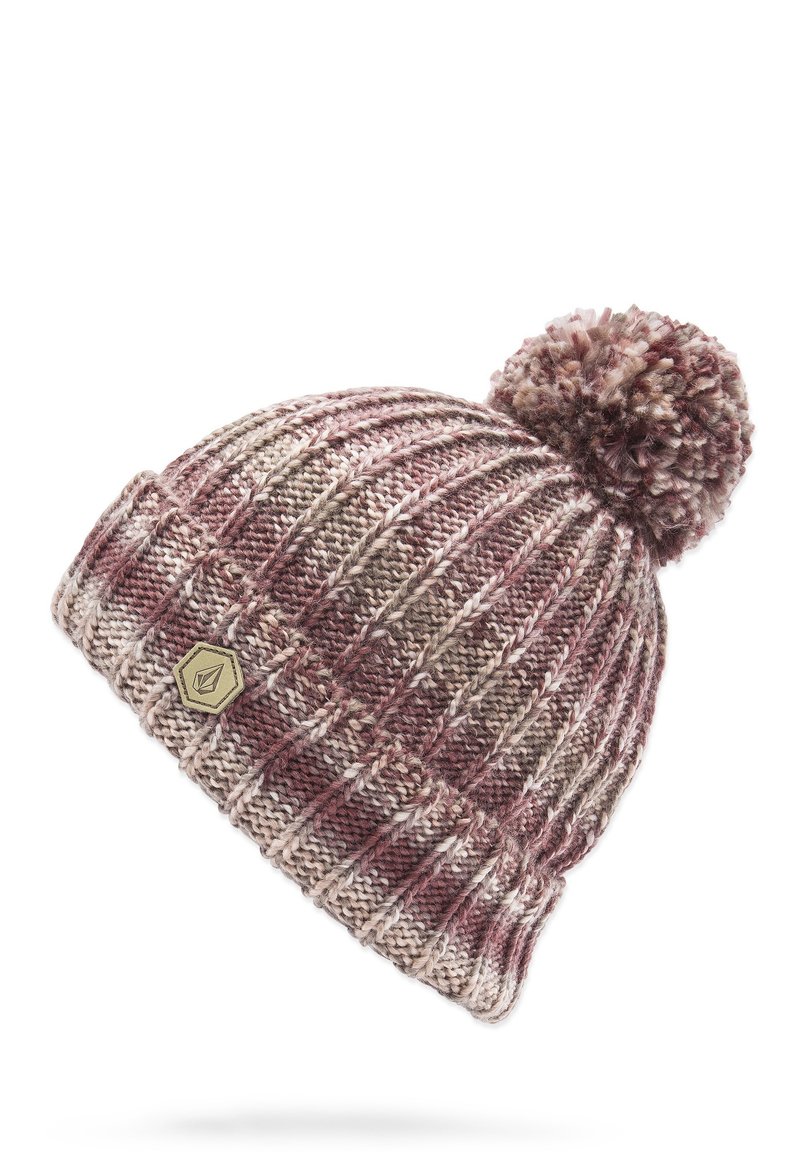 Knitted beanie in maroon, beige, and brown tones with a textured pattern and a fuzzy pom-pom on top. Features a small, gold emblem.