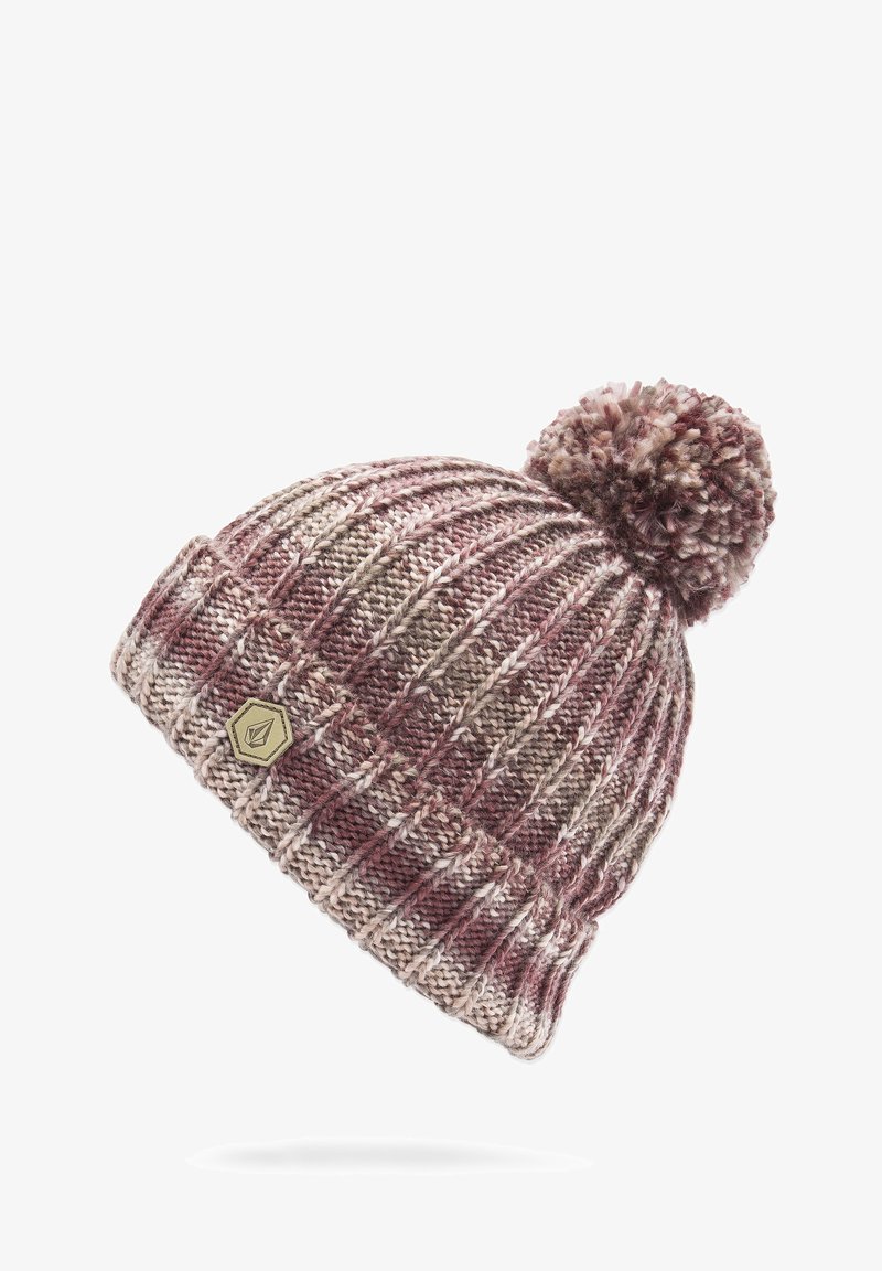 Knitted beanie in maroon, beige, and brown tones with a textured pattern and a fuzzy pom-pom on top. Features a small, gold emblem.