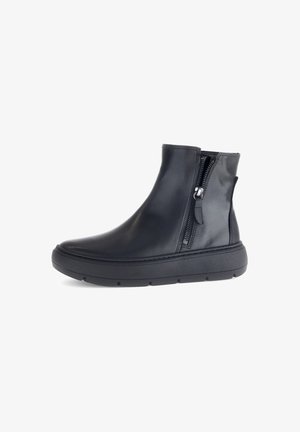 Black ankle boot made of smooth leather, featuring a side zipper, rubber sole, and a low-profile design for comfort and ease of wear.
