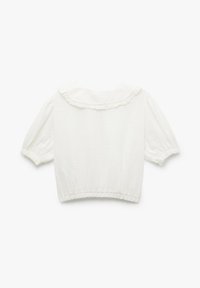 Hvid cropped bluse med korte pufærmer, en flæsekrave og elastisk kant. Lavet af et let, tekstureret stof.