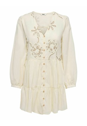 Robe crème à manches longues avec boutonnage devant, jupe à volants et motifs floraux brodés sur le corsage.