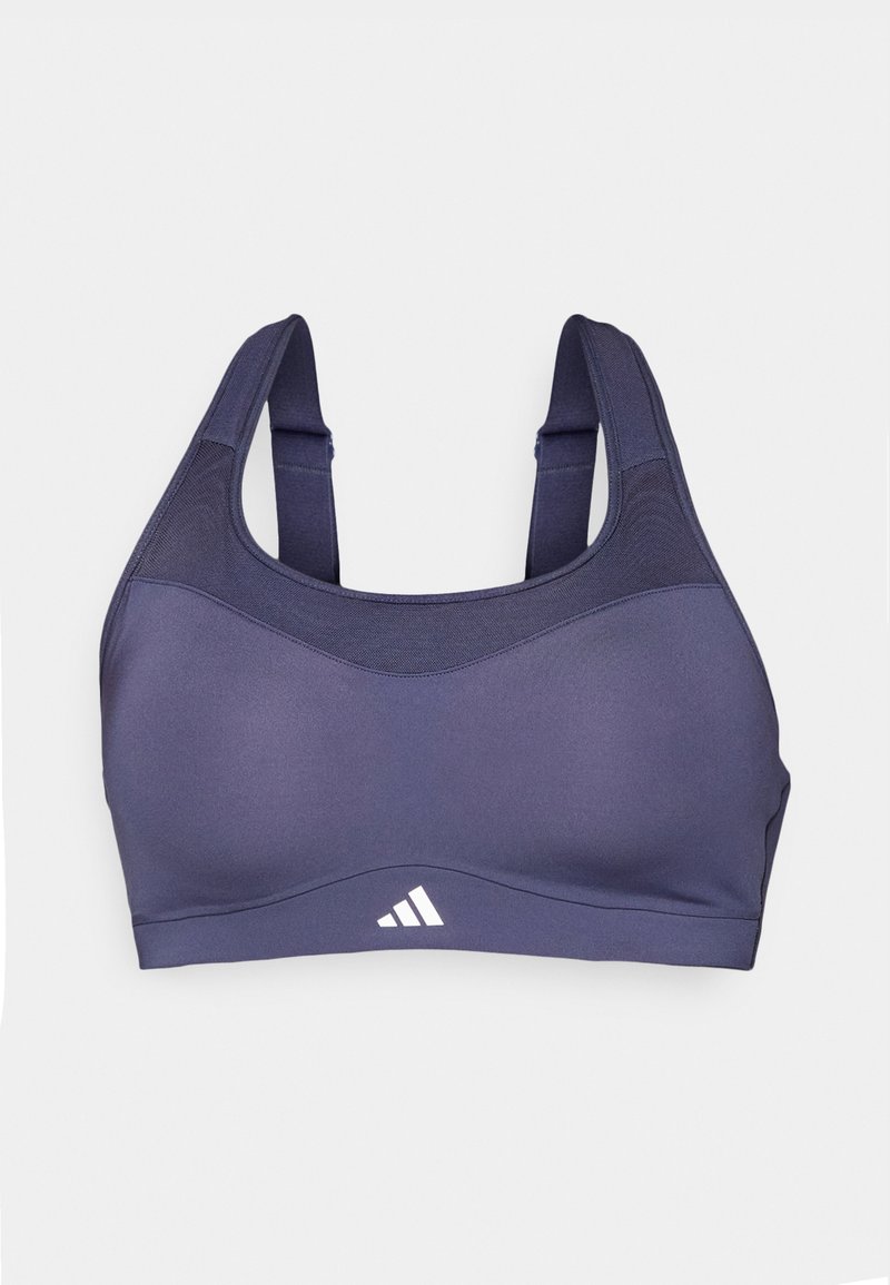 Soutien-gorge de sport marine avec une texture lisse, des bretelles larges et un accent de logo subtil en blanc en bas. Offre un design de soutien.