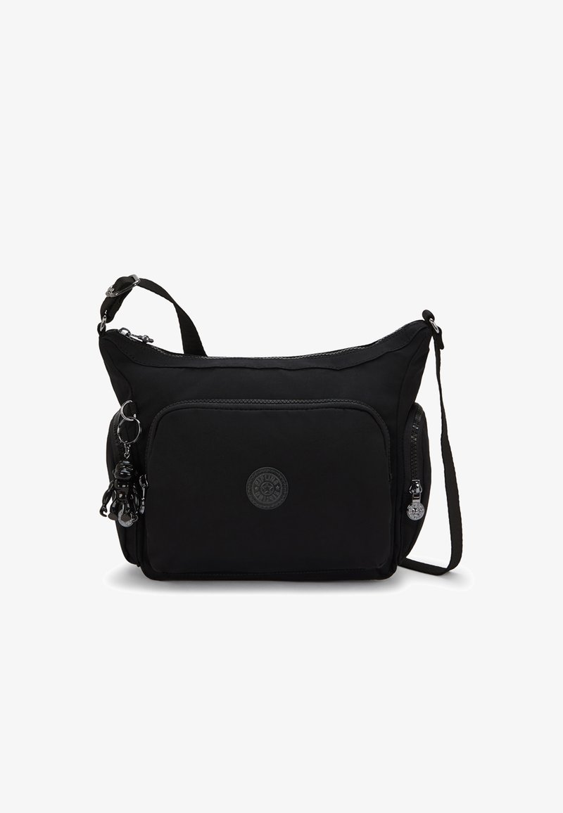 Borsa a tracolla nera in nylon con chiusura a zip, tasca frontale e logo circolare. Presenta un charm removibile e una tracolla regolabile.