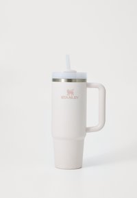 Light pink insulated tumbler with a textured finish, stainless steel band near the top, and a matching lid with a straw. Features a handle.