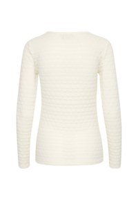 Witte longsleeve top van een gestructureerde stof met een golvend patroon. Ronde halslijn en slim fit, ontworpen zonder zichtbare sluitingen.