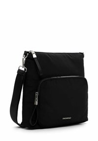 Black nylon crossbody bag with a zippered main compartment, an additional front pocket, adjustable strap, and silver hardware accents.