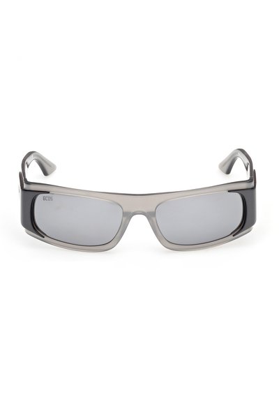Lunettes de soleil rectangulaires avec verres teintés gris et montures épaisses translucides gris et noir.