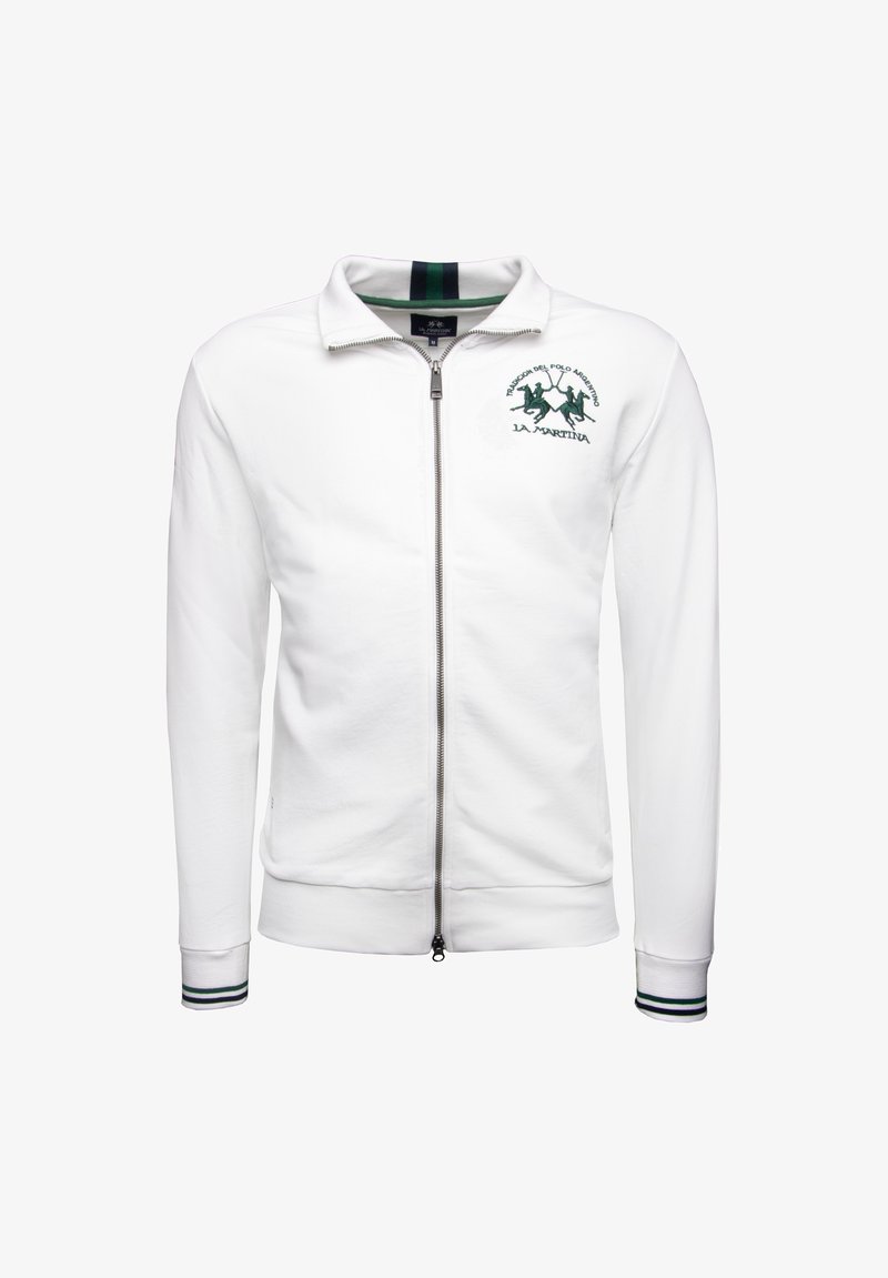 White zip-up jacket with a high collar, featuring a green embroidered logo and double-stripe accents on the cuffs. Soft fabric texture.