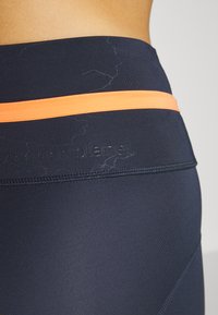 Puma RUN FIRST MILE BIKER - Leggings - parisian night