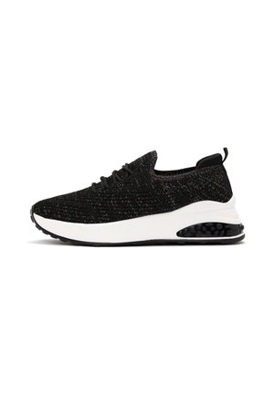 Black athletic shoe with a textured knitted upper, white midsole, and a black rubber sole featuring a visible air cushioning unit.