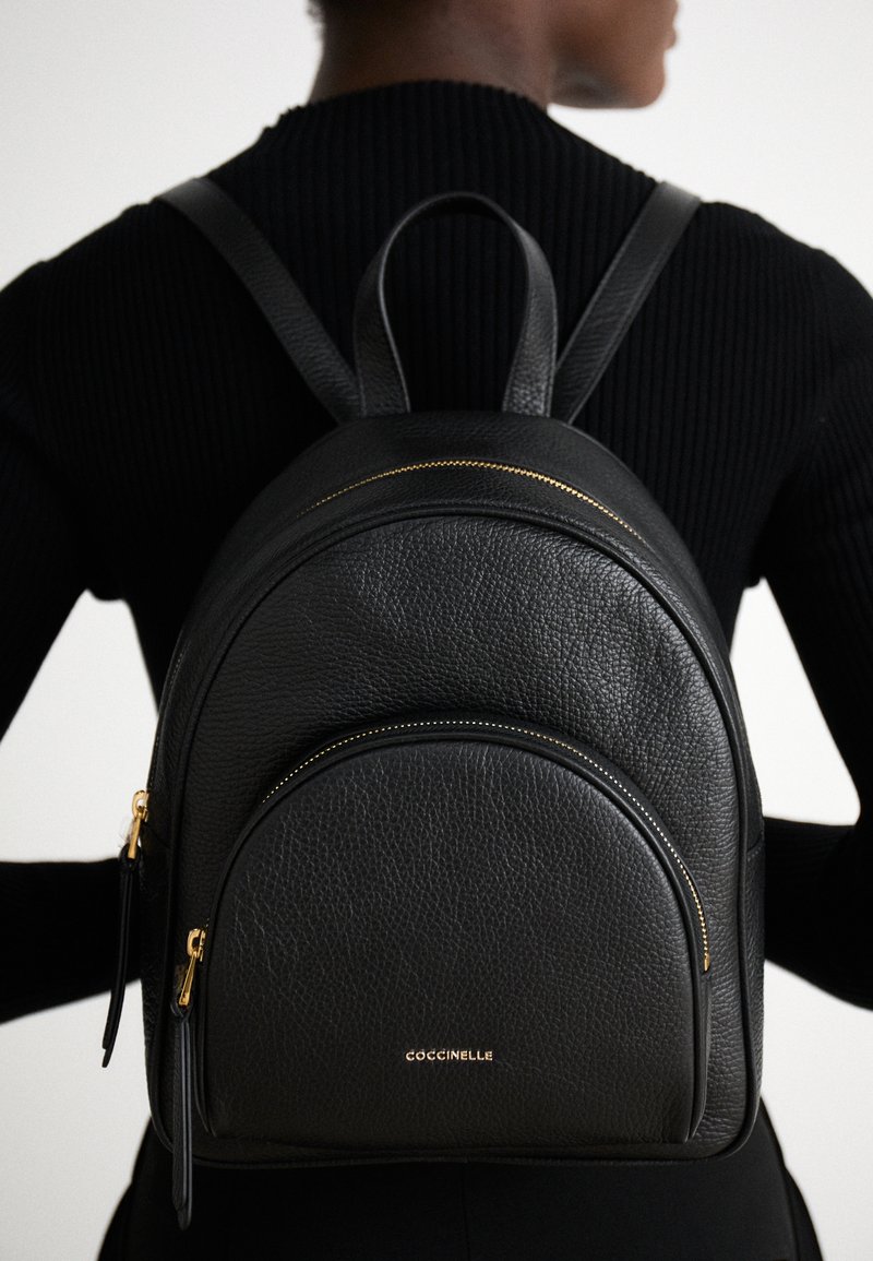 coccinelle mini backpack Nikla grained leather aquamarine/deep blue This model is made with leather processed using specialised machines and then tumbled for an extremely soft finish Coccinelle Zaino Coccinelle Alpha Rucksack