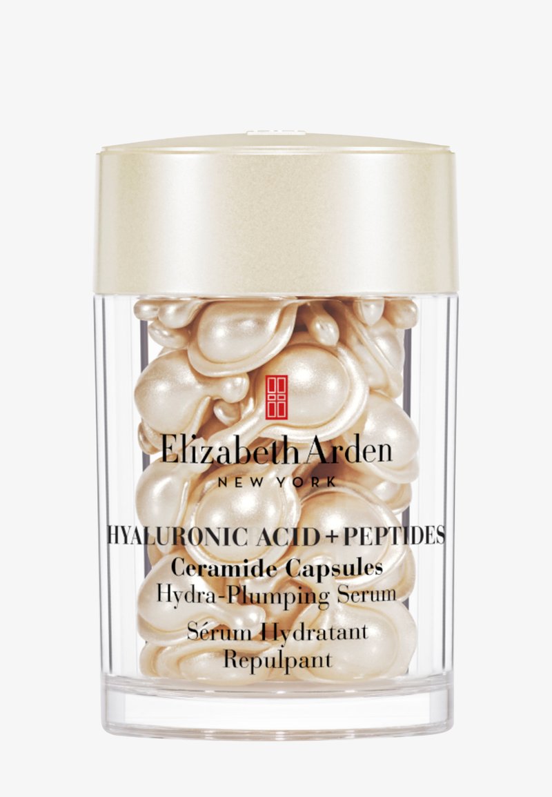 Contenant transparent avec des capsules de sérum couleur perle portant l’étiquette Elizabeth Arden Hyaluronic Acid + Peptides Ceramide Capsules Hydra-Plumping Serum.