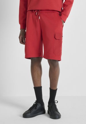 REGULAR FIT IN INTERLOCK  WITH PLATE ON CONTRAST POCKET - Pantaloni sportivi - dark red