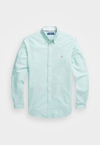 Ljus mintgrön långärmad skjorta i bomull. Har en knapp-down-krage, vita knappar och en liten broderad logotyp på bröstet.