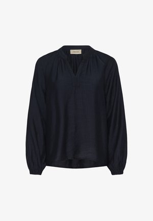 Tumši zils, viegls blūze ar V-veida kaklu un savāktām detaļām. Garas piedurknes ar elastīgām aprocēm, piedāvājot brīvu piegriezumu un gludu tekstūru.
