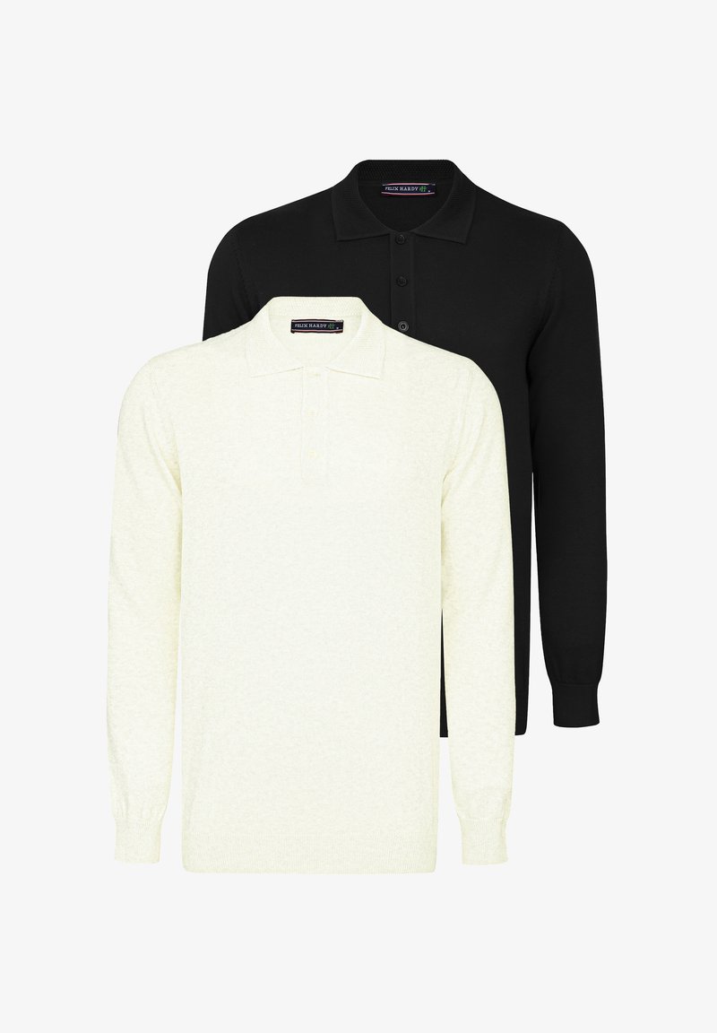 Polo in nero e crema, maniche lunghe, realizzati in un tessuto testurizzato. Ognuno presenta un colletto classico e una placca con tre bottoni.