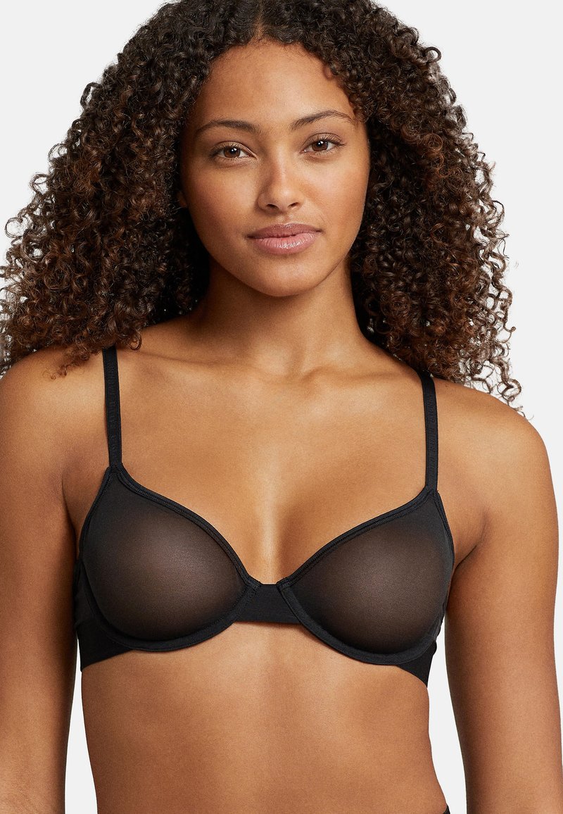 Czarny biustonosz z przeźroczystymi miseczkami, regulowanymi ramiączkami i eleganckim wzorem. Miękka tkanina z bezszwowymi krawędziami i skromnym kryciem.