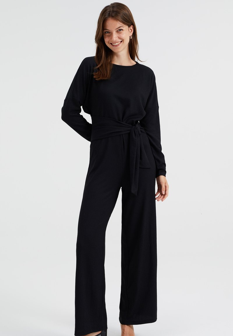 WE Fashion MET STRUCTUUR Jumpsuit black/schwarz Zalando.ch