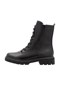 Botas de tobillo de cuero negro con punta redondeada, parte delantera con cordones, superficie texturizada y suela de goma resistente con un dibujo prominente.