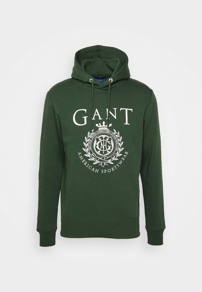 Sudadera de algodón verde con un gran logo blanco y un intrincado diseño de escudo en el frente, capucha con cordones y puños de canalé.
