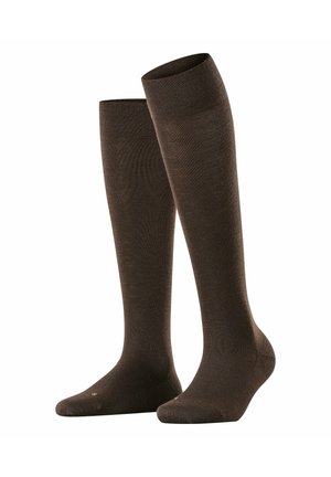 Bruine kniekousen van een glad, textiel materiaal met een fijne breistekstuur. Heeft een versterkte teen en een elastische boord.