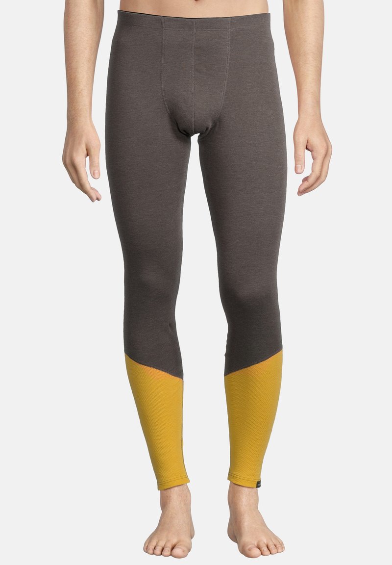 Grijze leggings met een snug fit, voorzien van felgele accenten op de onderbenen en een gestructureerde afwerking bij de boorden.