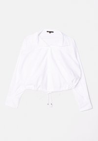 Hvid cropped bluse lavet af et glat stof, med en bred krave, knaplukning og snor i kanten med sølvperle-detaljer.
