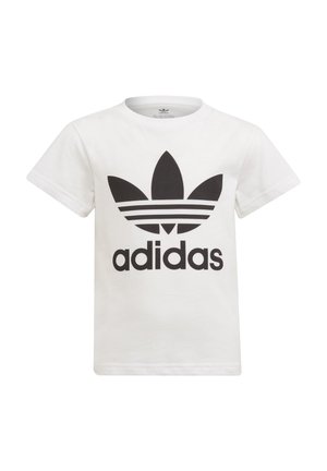 Maglietta bianca in cotone con scollatura rotonda, maniche corte, caratterizzata da un grande logo Adidas nero e tre strisce nere sotto il logo.