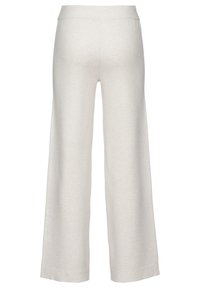 Helle Beigefarbene weit geschnittene Hose aus einem weichen, strukturierten Stoff mit einem elastischen Bund und schlichtem Design.
