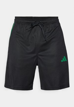 Svarte treningsshorts laget av teksturert mesh-stoff, med et grønt aksentstripes og grønt Adidas-logo på venstre ben. Snor i livet.