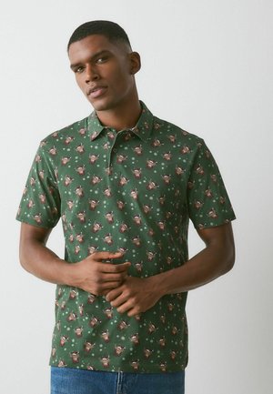 Next, CHRISTMAS SHORT SLEEVE MOTIONFLEX - Polo - green hamish the highland cow