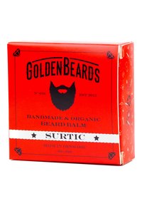 Röd pappkartong för skäggbalsam, med svart text, vit rand med "SURTIC" och illustrationer på sidorna; 60 ml storlek.