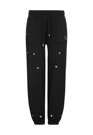 Czarne spodnie dresowe z elastycznym pasem, dwoma dużymi przednimi kieszeniami, zatrzaskami i ściągaczami u dołu nogawek.