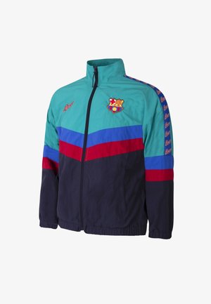 Windbreakerjack met een teal, blauwe, rode en marine kleurblokontwerp. Inclusief een ritssluiting aan de voorkant, hoge kraag en teamlogo op de borst.