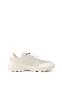Beige athletic shoe with mesh and suede materials, rounded toe, thick sole, and contrasting textures. Features sleek design and lacing system.