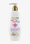 OGX FRIZZ DEFYING + COCONUT MIRACLE OIL AIR DRY CREAM - Hårserum
