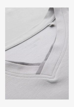 Light gray t-shirt with a textured fabric, featuring a V-neck design and a subtle mesh trim along the neckline.