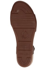 Suola di sandalo in gomma marrone con motivi di battistrada lineari e un emblema solare. Presenta il marchio "COSMOS comfort" e l'impronta della taglia "37".