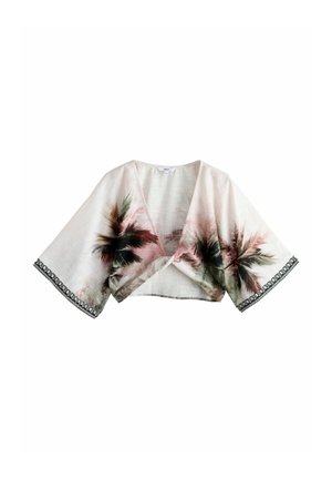 Lichtbeige cropped wikkelblouse met brede mouwen, palmboomprint en zwarte decoratieve afwerking aan de mouwranden.
