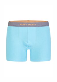 Helle blaue Boxershorts aus weichem Stoff, mit einem gemusterten Bund, auf dem "HAPPY SHORTS" in Orange gedruckt ist.