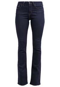 Jean denim bleu foncé taille haute avec fermeture à boutons et zip, poches avant et arrière, et jambes légèrement évasées.