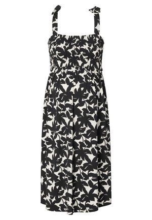 Zwart-witte bloemenjurk met een smock-borstvoorkant, verstelbare schouderbanden en een vloeiende rok. Gemaakt van lichtgewicht stof.