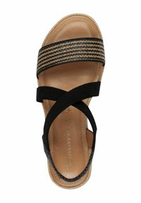 Black and tan sandals with a textured woven strap, crossed fabric bands, and a smooth leather insole. Flat sole with slight edge detailing.
