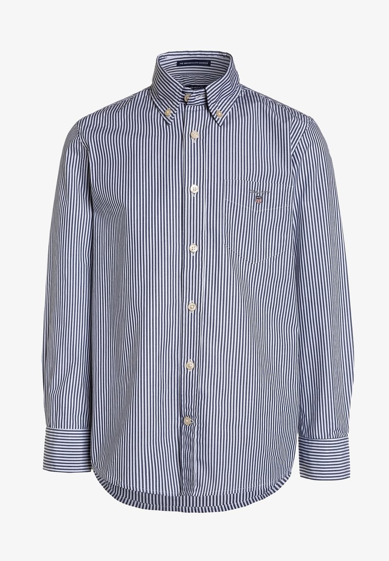 Chemise à manches longues boutonnée avec rayures verticales bleu marine et blanches, col boutonné, poche poitrine avec logo et poignets boutonnés.