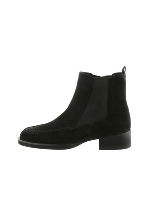 Bottine en suédine noire avec des panneaux élastiques sur les côtés, bout arrondi, couture proéminente et un petit talon carré. Inclut une languette à l'arrière.