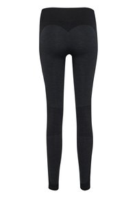 Leggings neri con una sezione superiore texturizzata, pannelli inferiori solidi e un design distintivo a forma di cuore sul retro. Finitura in tessuto liscia.