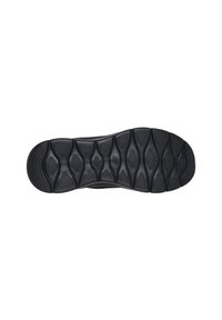 Semelle de basket noire avec un motif texturé, présentant des rainures allongées et des crampons pour une meilleure adhérence. Matériau en caoutchouc durable.