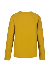 Långärmad skjorta i strukturerad senapsgul tyg. Har raglanärmar och rundad halsringning. Enkel, oförskönad design.